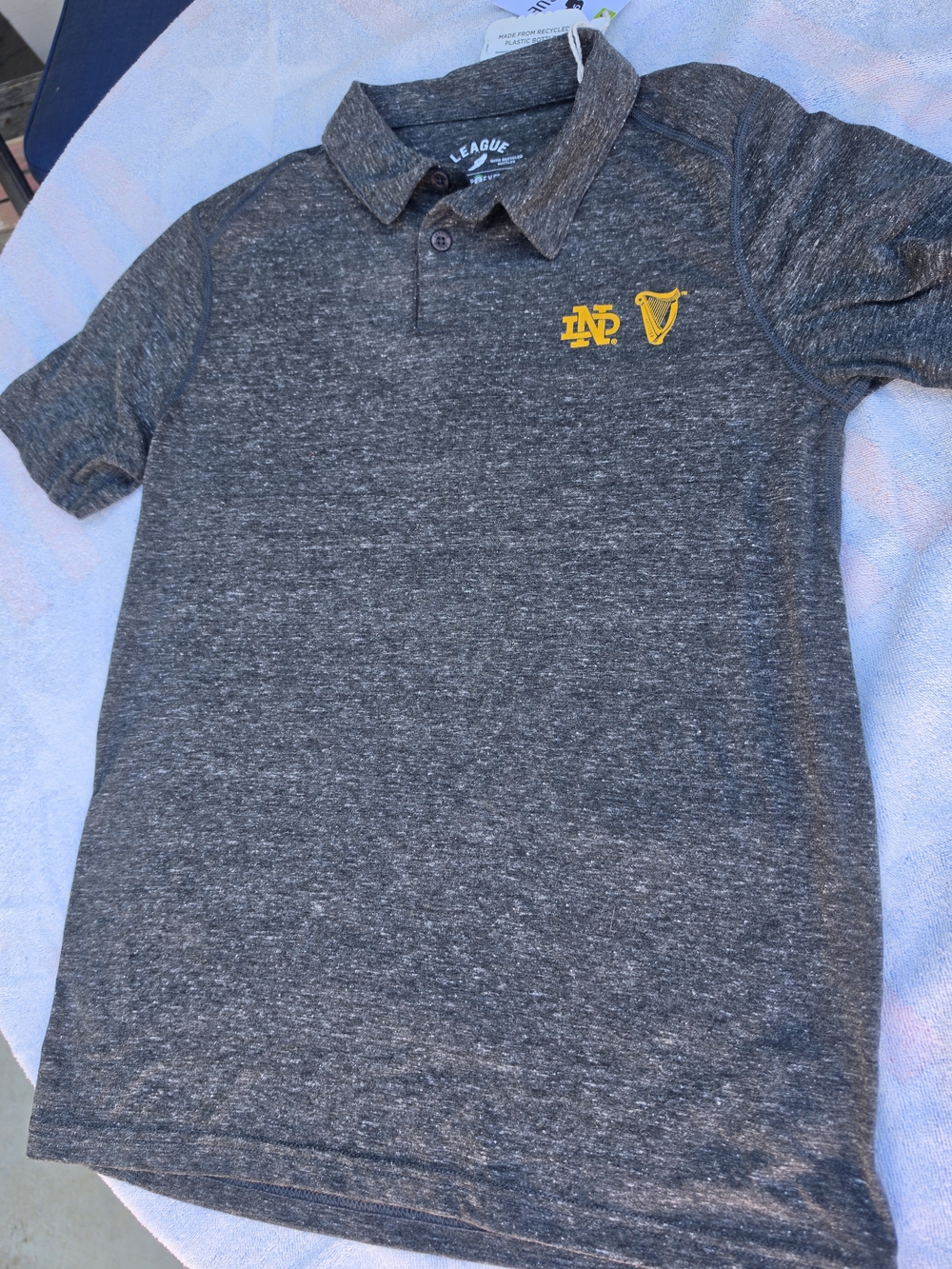 League Women's Heather Charcoal Polo with Yellow University Of Notre Dame Logo